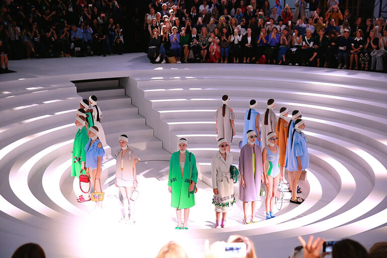 models on a circular stage with steps down at Anya Hindmarch show at London Fashion Week