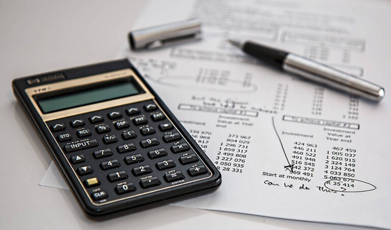 budgets, spreadsheet, calculator, and pen