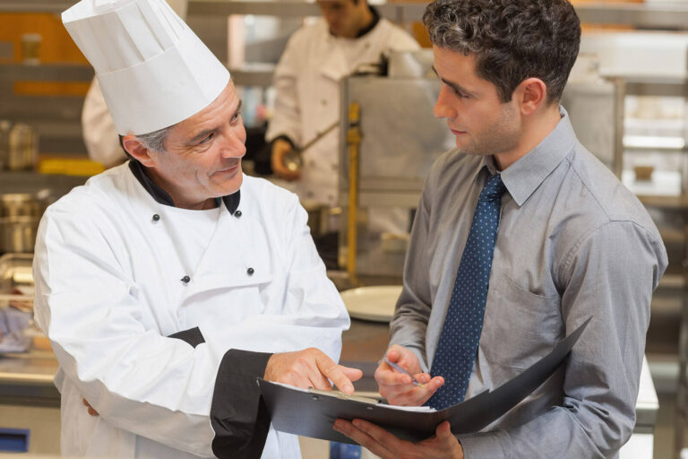 chef discussing menus with catering event planner