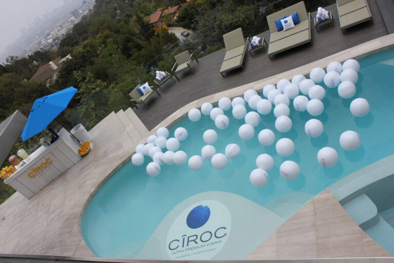 pool decorated with floating white beach balls at Ciroc Summer experiential marketing event