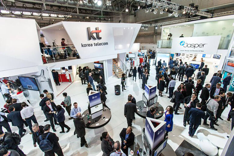 view of stands on the exhibition floor of Mobile World Congress convention hall