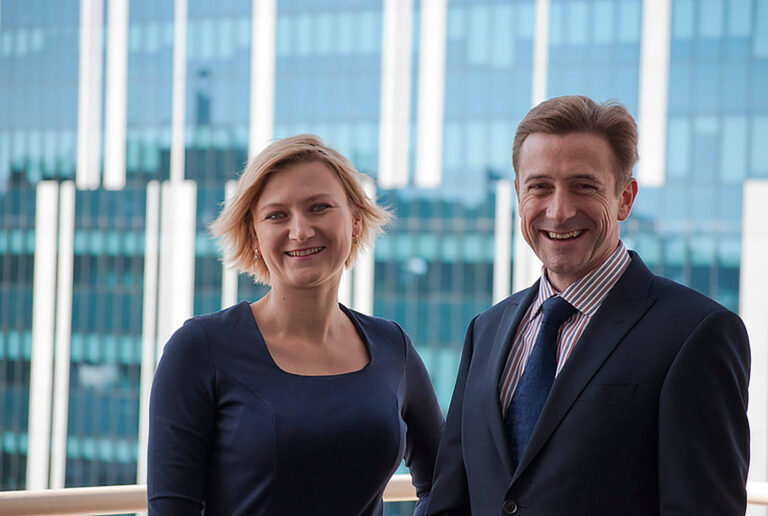 male and female corporate event planners in business suits
