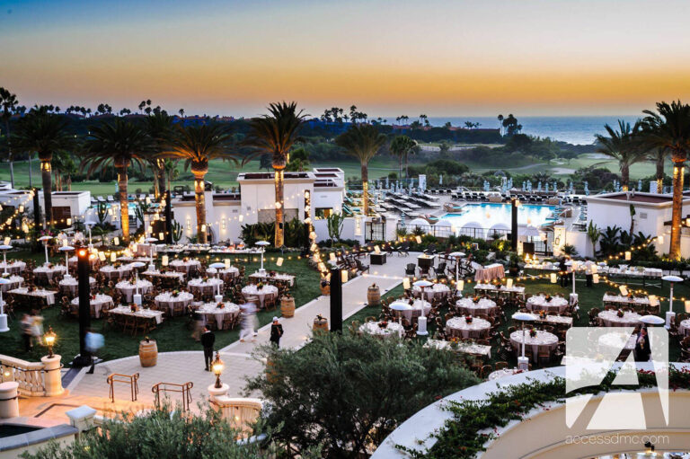 dinner tables set up outdoors for corporate meeting evening dinner by ACCESS Destination Services