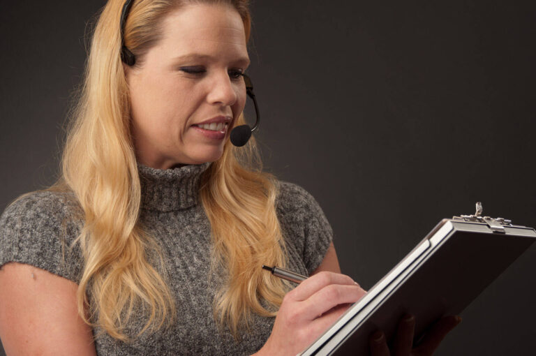 event planner with a clipboard and headset