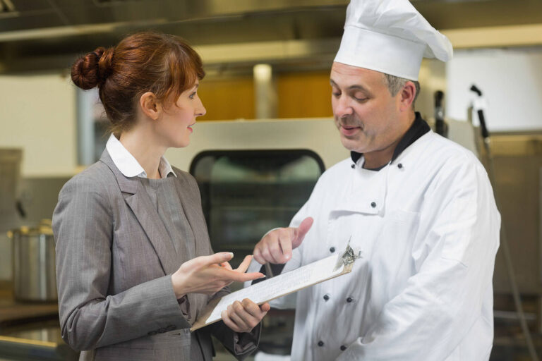 event planner discussing menus with a chef