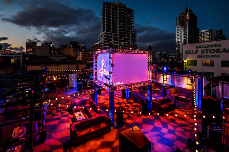 outdoor party venue bathed in red lighting for Fandango MovieClips App Launch Event
