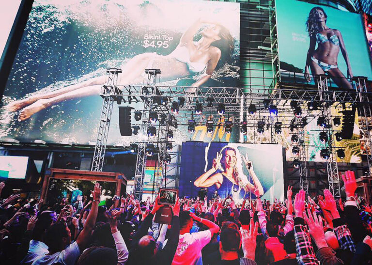 Billboards and stage at H&M Ultimate Summer Moments experiential marketing event Times Square