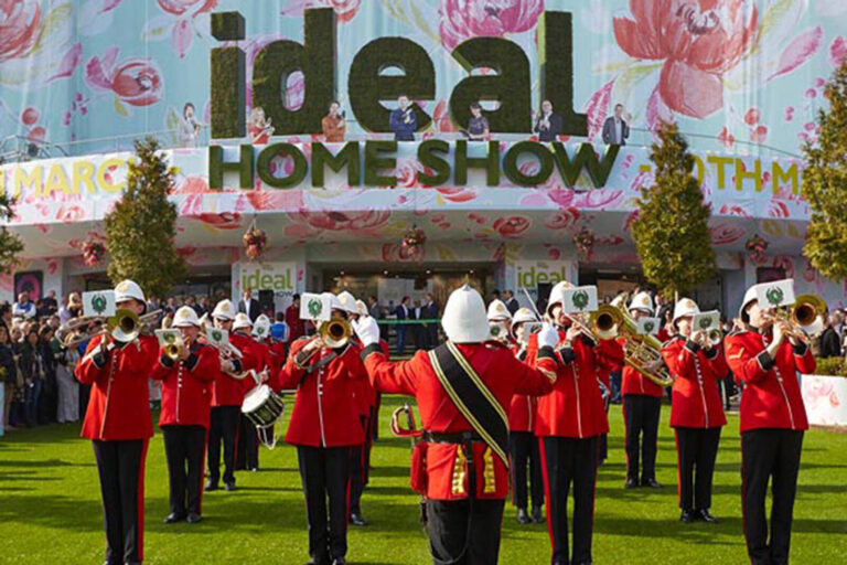 Brass marching band performing outside the Ideal Home Show convention and exhibition