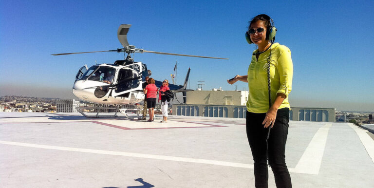 event staff wearing headset assisting transfers via helicopter