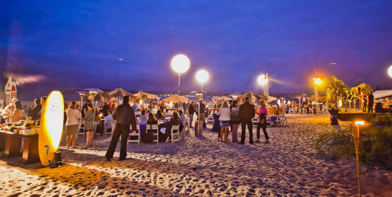 people at a beach party at night