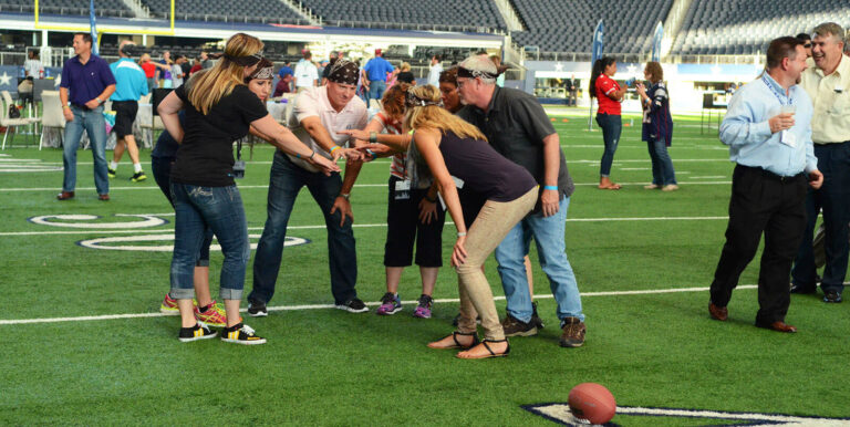employees at a private event on the pitch of a football stadium