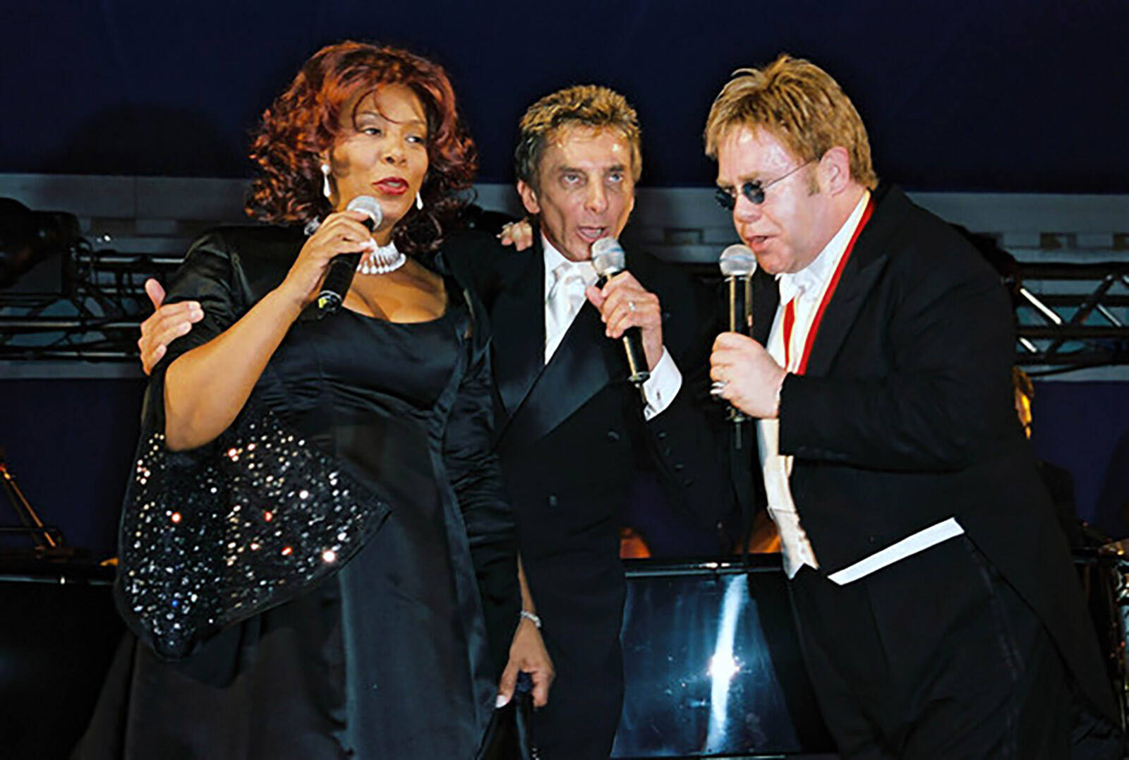 Donna Summer, Barry Manilow, and Elton John perform at Elton John's White Tie & Tiara Ball produced by Matt James of Leftfield Productions