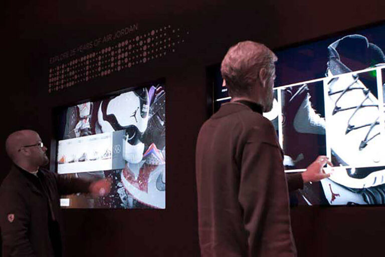 men using interactive touch screens at Nike Jordan 23/25 experiential marketing event