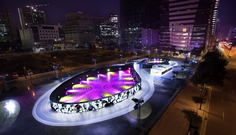 Nike Unlimited Stadium lit up at night