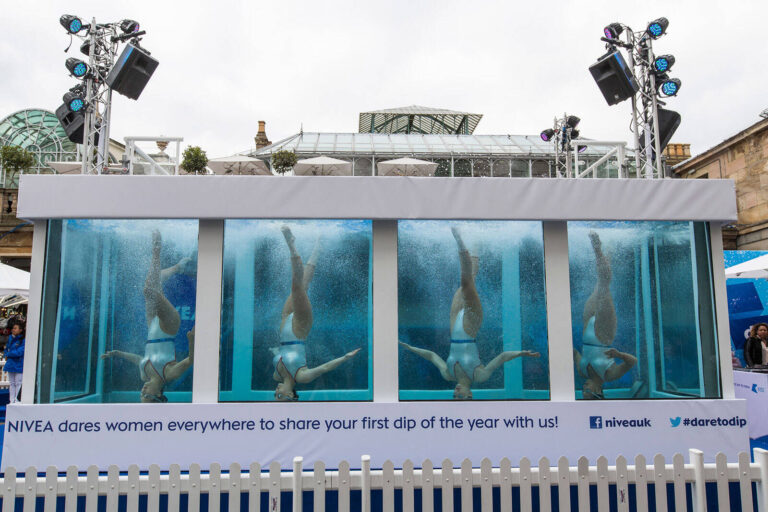 synchronized swimmers in a tank for the Nivea Dare to Dip experiential marketing event