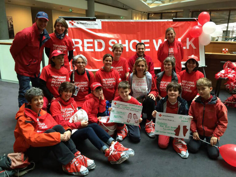 volunteers and staff at The Red Shoe Walk fundraising event for The British Red Cross