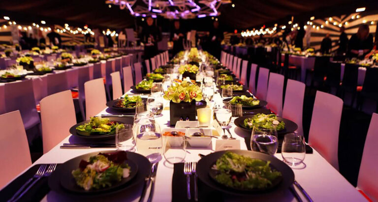long dining tables set up for a special event dinner