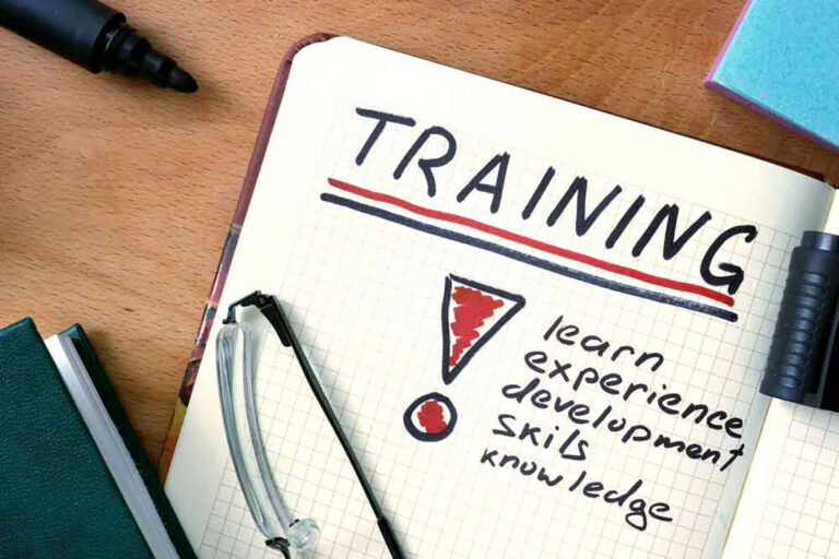 Notes in a notebook that read 'Training: learn, experience, development, skills, knowledge