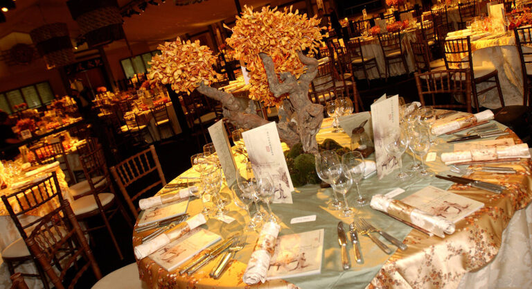 Dining tables in a tent for Elton John's Sixth Annual White Tie & Tiara Ball